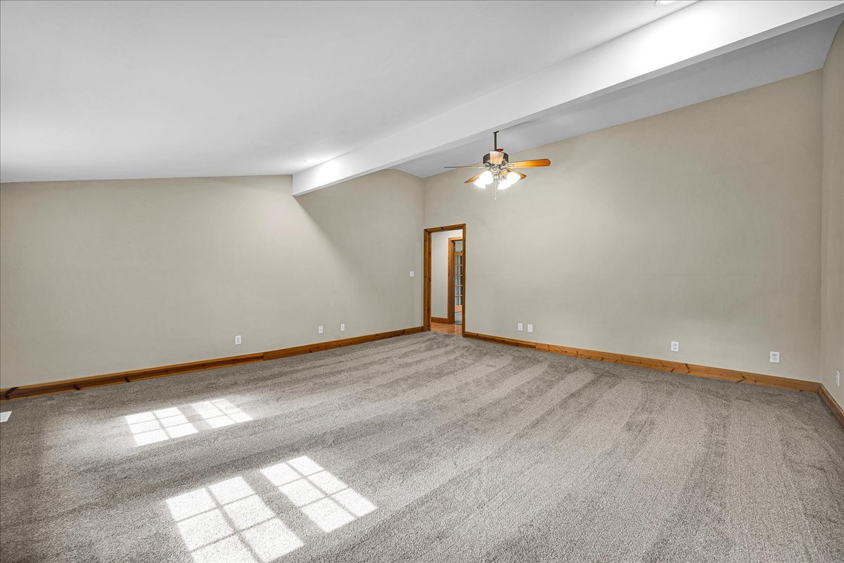 116 Lakeview Road East Galesburg, IL 61430 - Photo 12 of 36 an empty room with wooden floor and windows