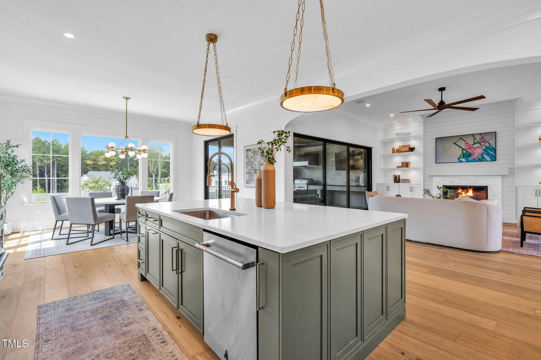 8917 Grand Highland Way Wake Forest, NC 27587 - Photo 14 of 80 a kitchen with stainless steel appliances granite countertop counter space a dining table and chairs