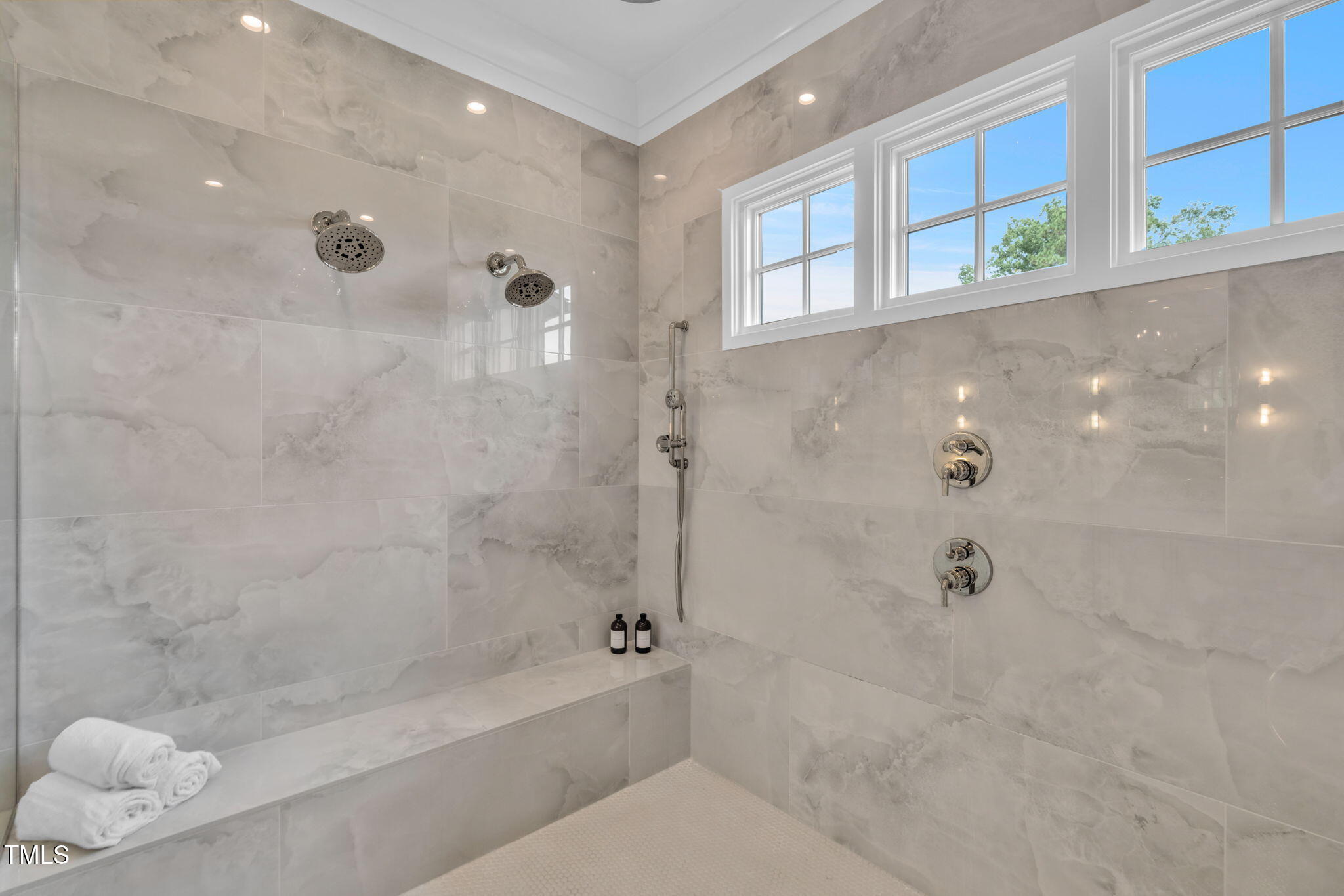 8917 Grand Highland Way Wake Forest, NC 27587 - Photo 33 of 80 a bathroom with a bathtub and a shower