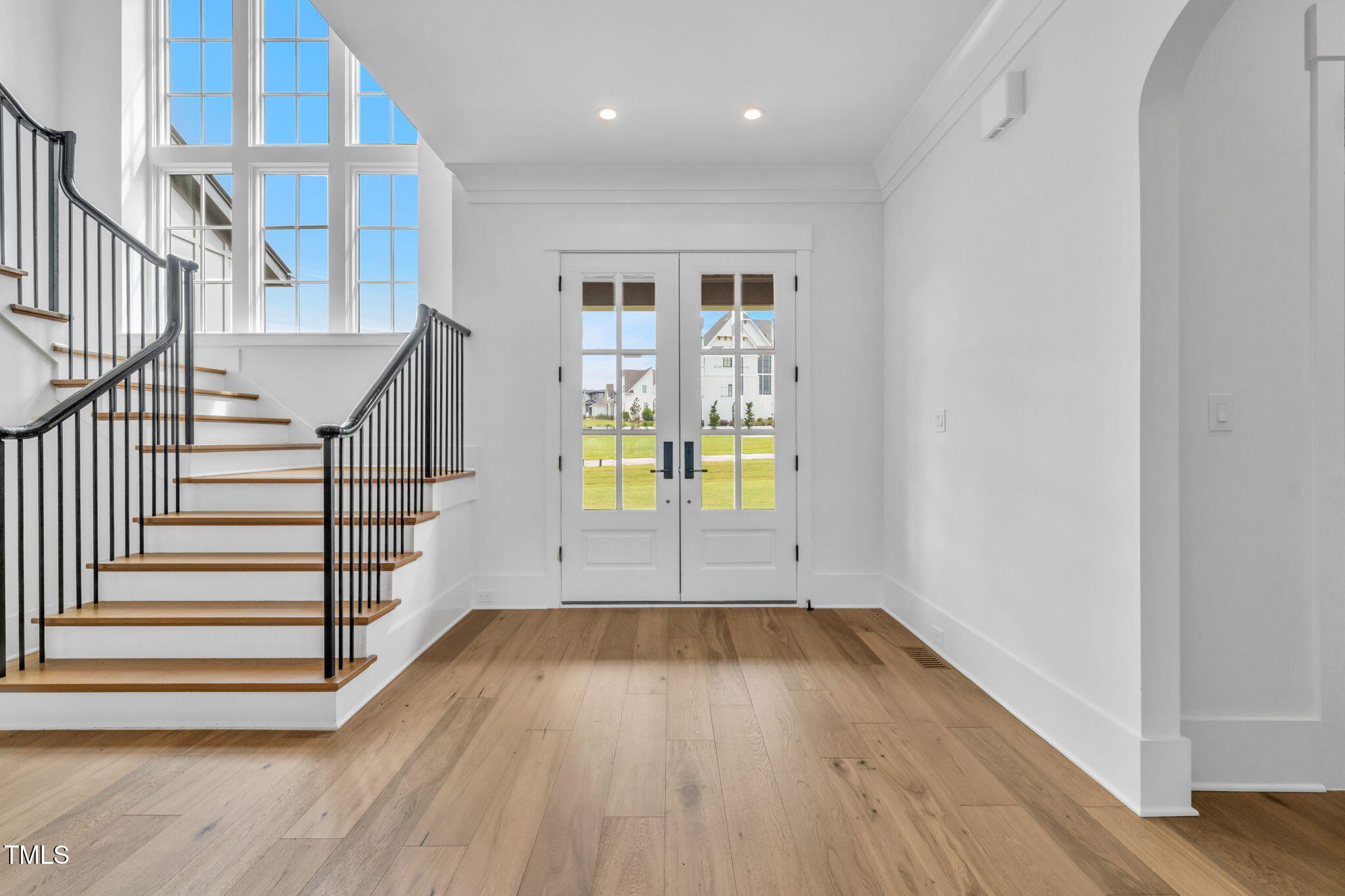8917 Grand Highland Way Wake Forest, NC 27587 - Photo 4 of 80 a view of an entryway with wooden floor