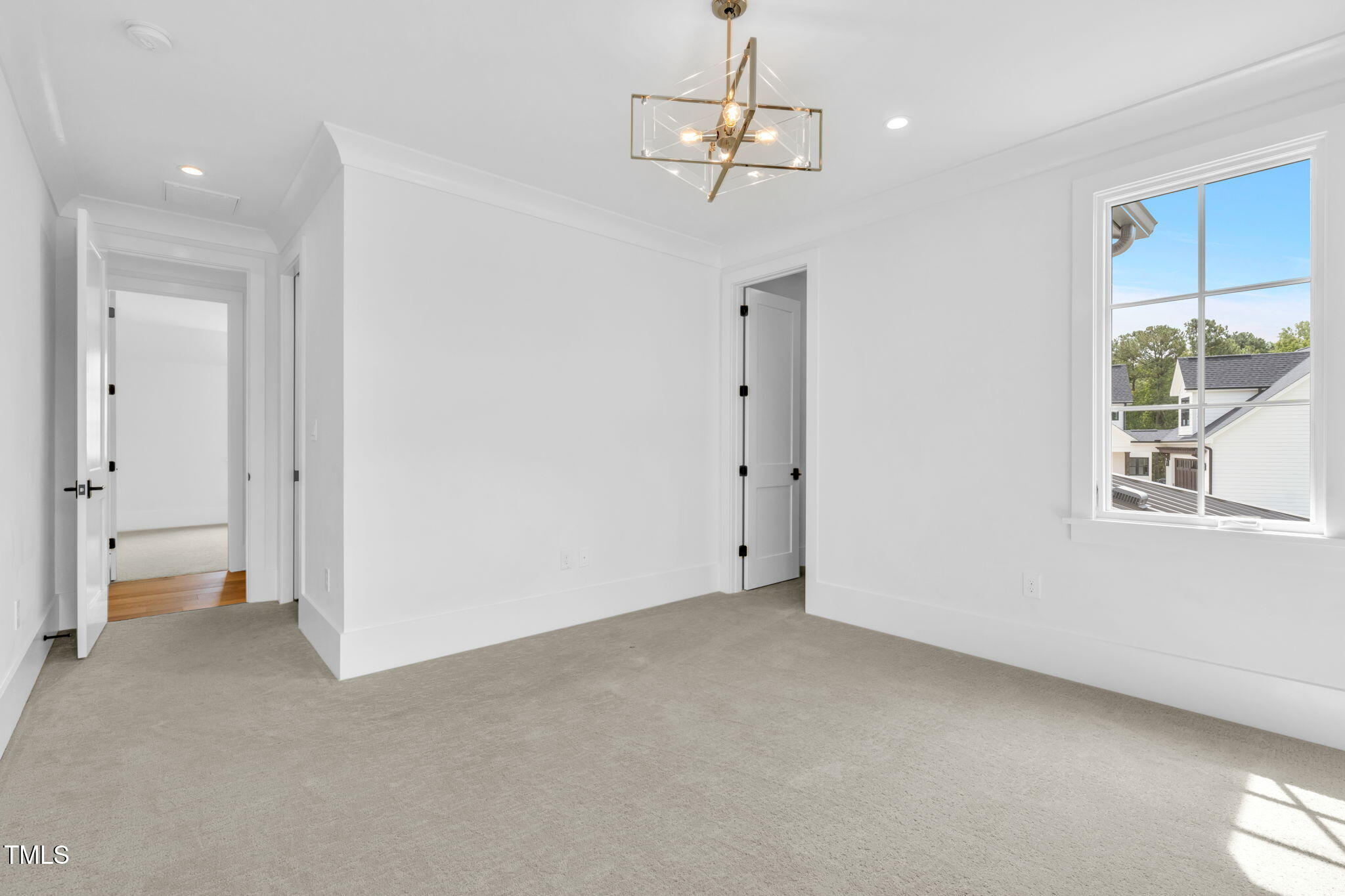 8917 Grand Highland Way Wake Forest, NC 27587 - Photo 48 of 80 a view of empty room with wooden floor