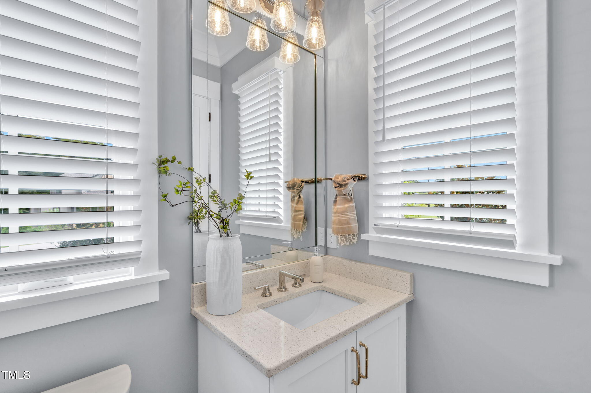 8917 Grand Highland Way Wake Forest, NC 27587 - Photo 58 of 80 a bathroom with a sink and a mirror