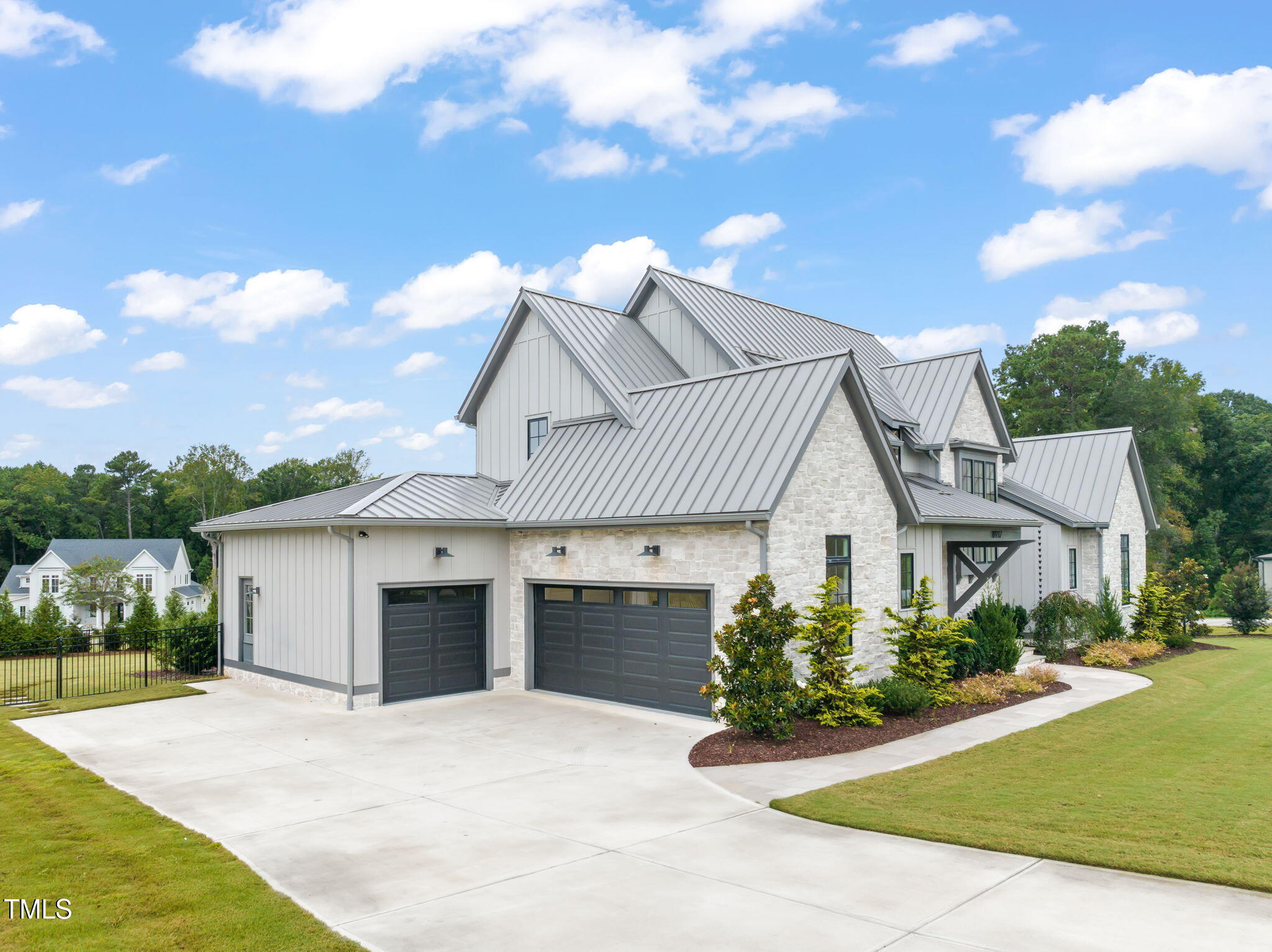 8917 Grand Highland Way Wake Forest, NC 27587 - Photo 71 of 80 a front view of a house with a yard and garage