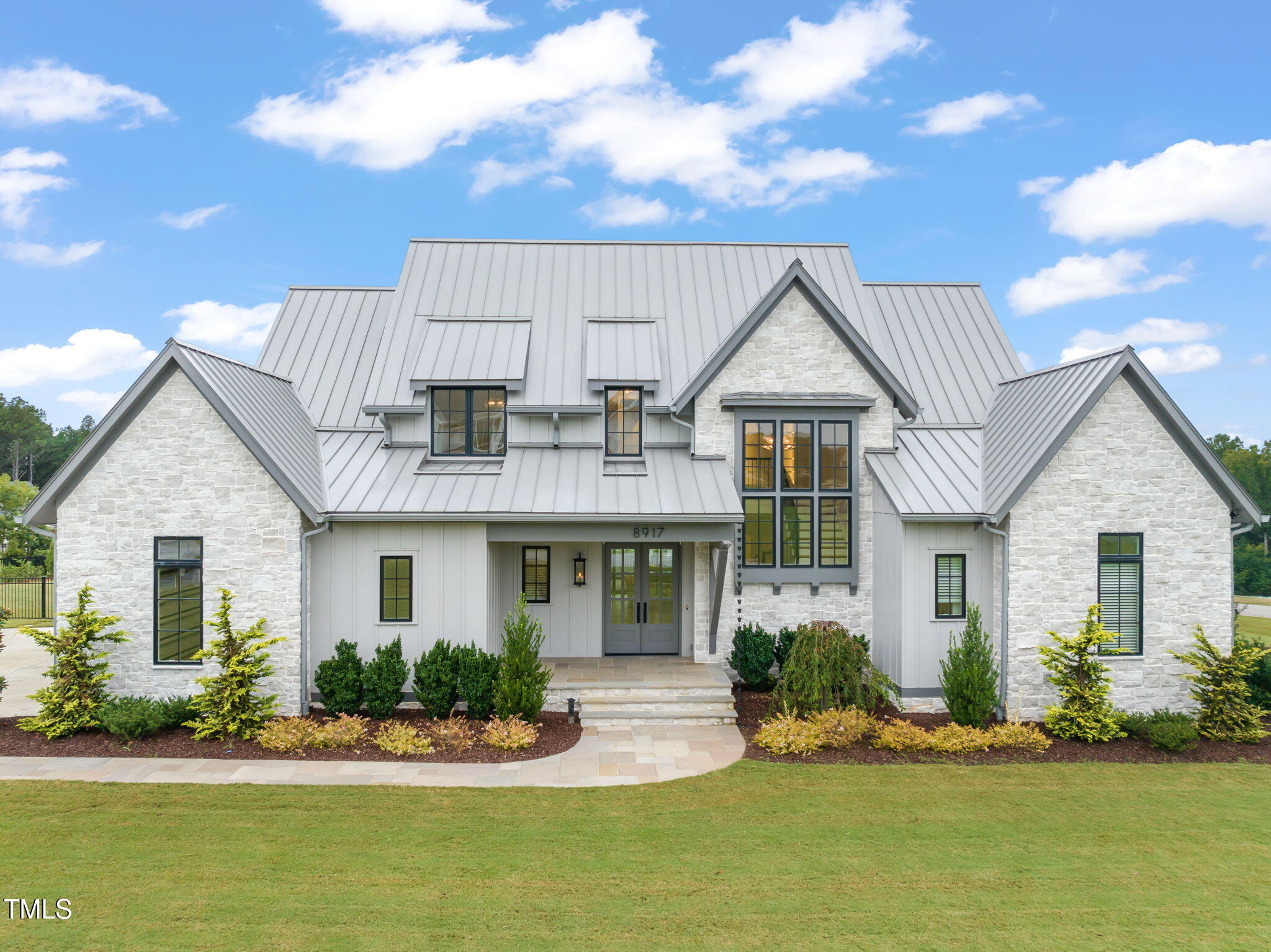 8917 Grand Highland Way Wake Forest, NC 27587 - Photo 73 of 80 a front view of a house with a yard