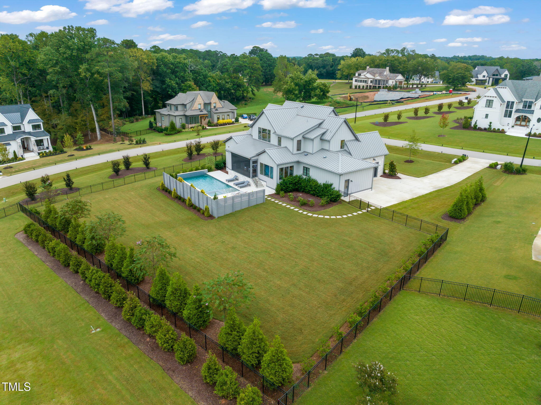 8917 Grand Highland Way Wake Forest, NC 27587 - Photo 75 of 80 a view of a house with pool and a yard