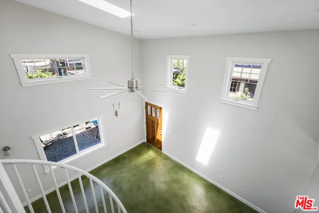 a view of room with window and hardwood floor