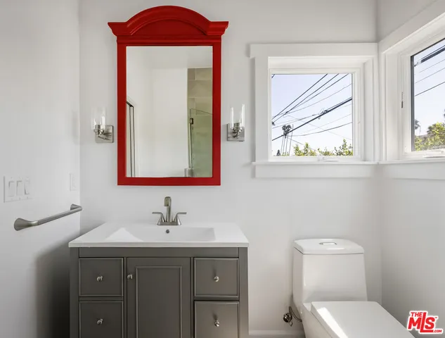 a bathroom with a shower and a sink