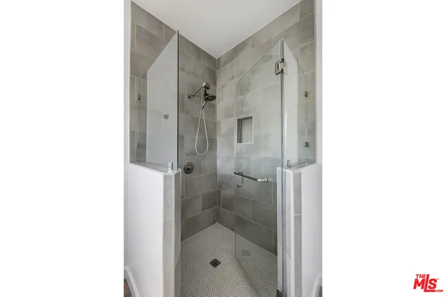 a view of a house with a small yard and a garden