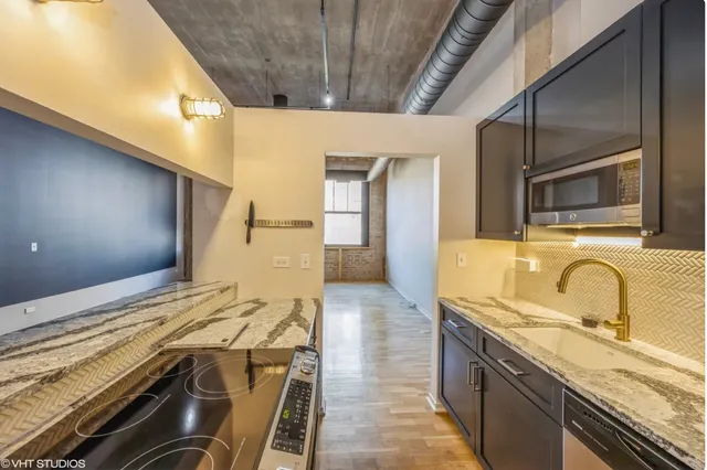 a spacious bathroom with a granite countertop sink and a mirror
