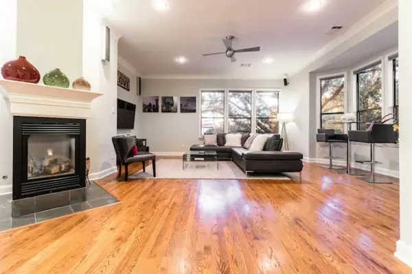 a living room with furniture and a fireplace
