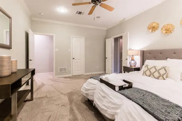 a bedroom with a bed and a table