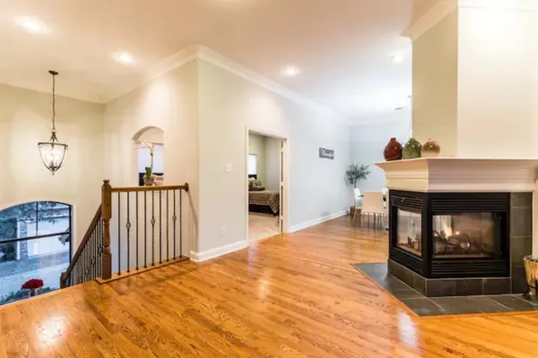 a bedroom with a bed and a fireplace