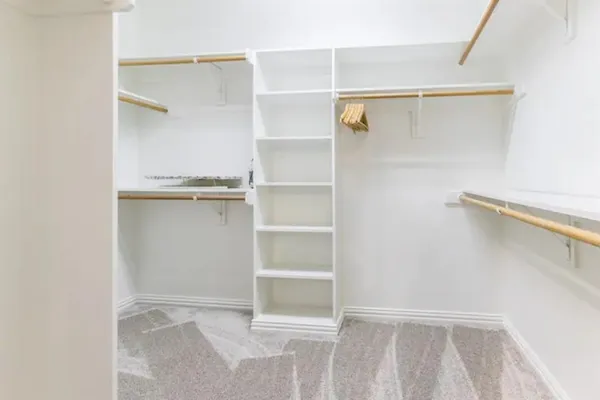 a view of an empty walk in closet