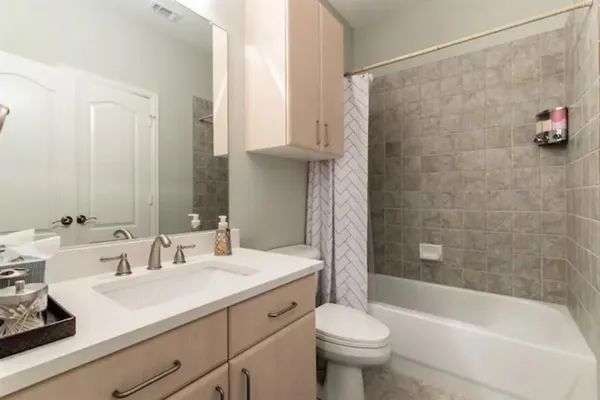 a bathroom with a sink a toilet and a bathtub