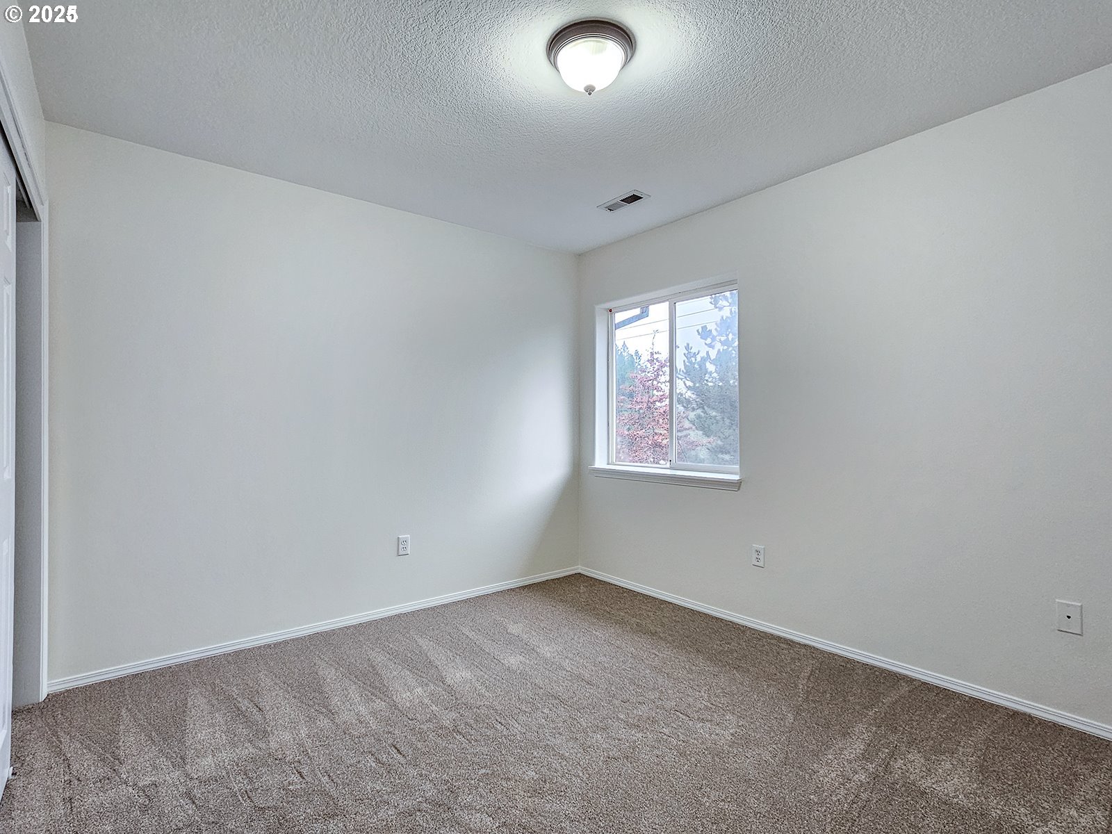 8754 Southwest Wakkila Terrace Beaverton, OR 97007 - Photo 11 of 19 an empty room with windows
