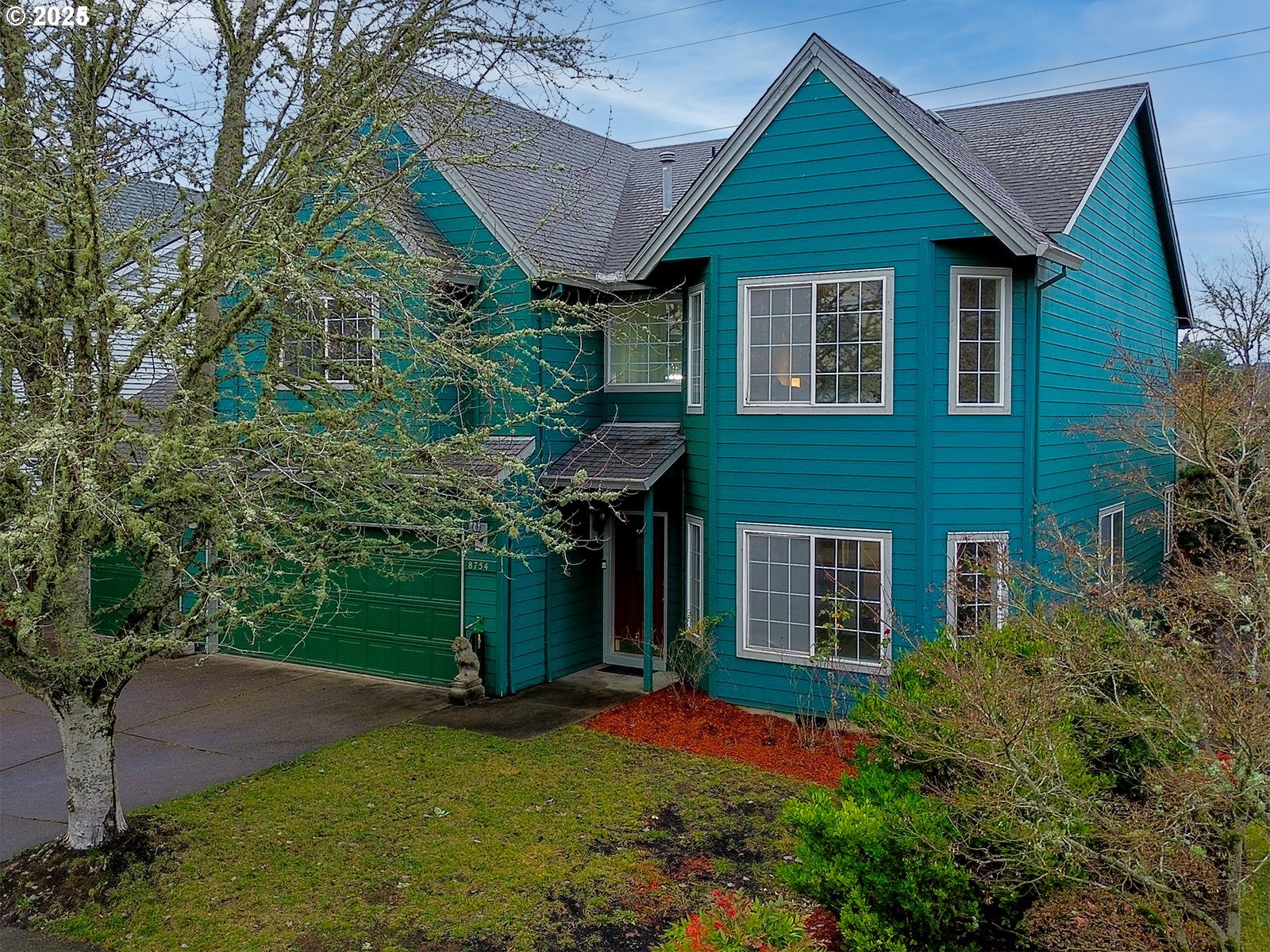 8754 Southwest Wakkila Terrace Beaverton, OR 97007 - Photo 12 of 19 a front view of a house with a yard