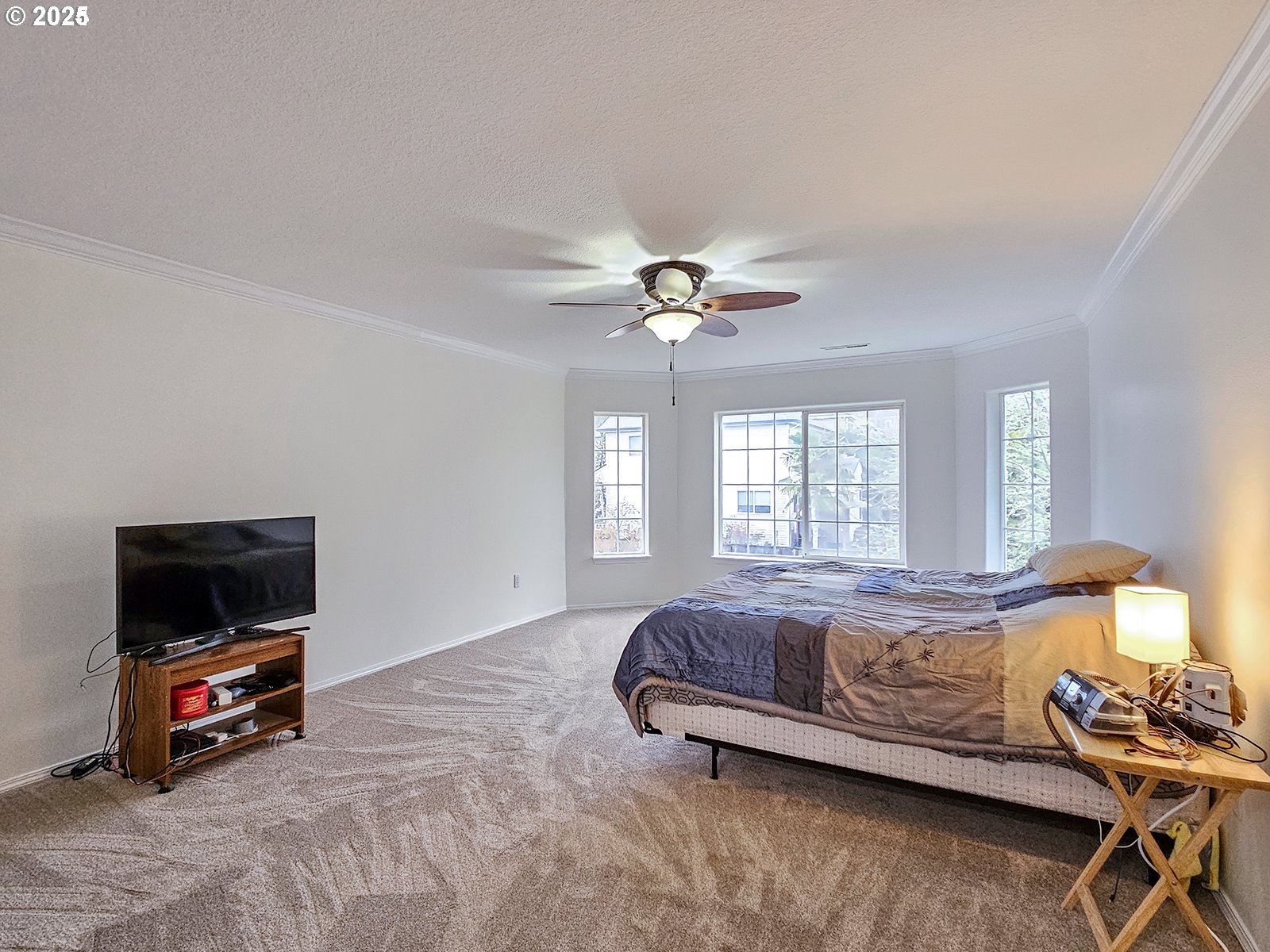 8754 Southwest Wakkila Terrace Beaverton, OR 97007 - Photo 2 of 19 a living room with a bed furniture and a flat screen tv