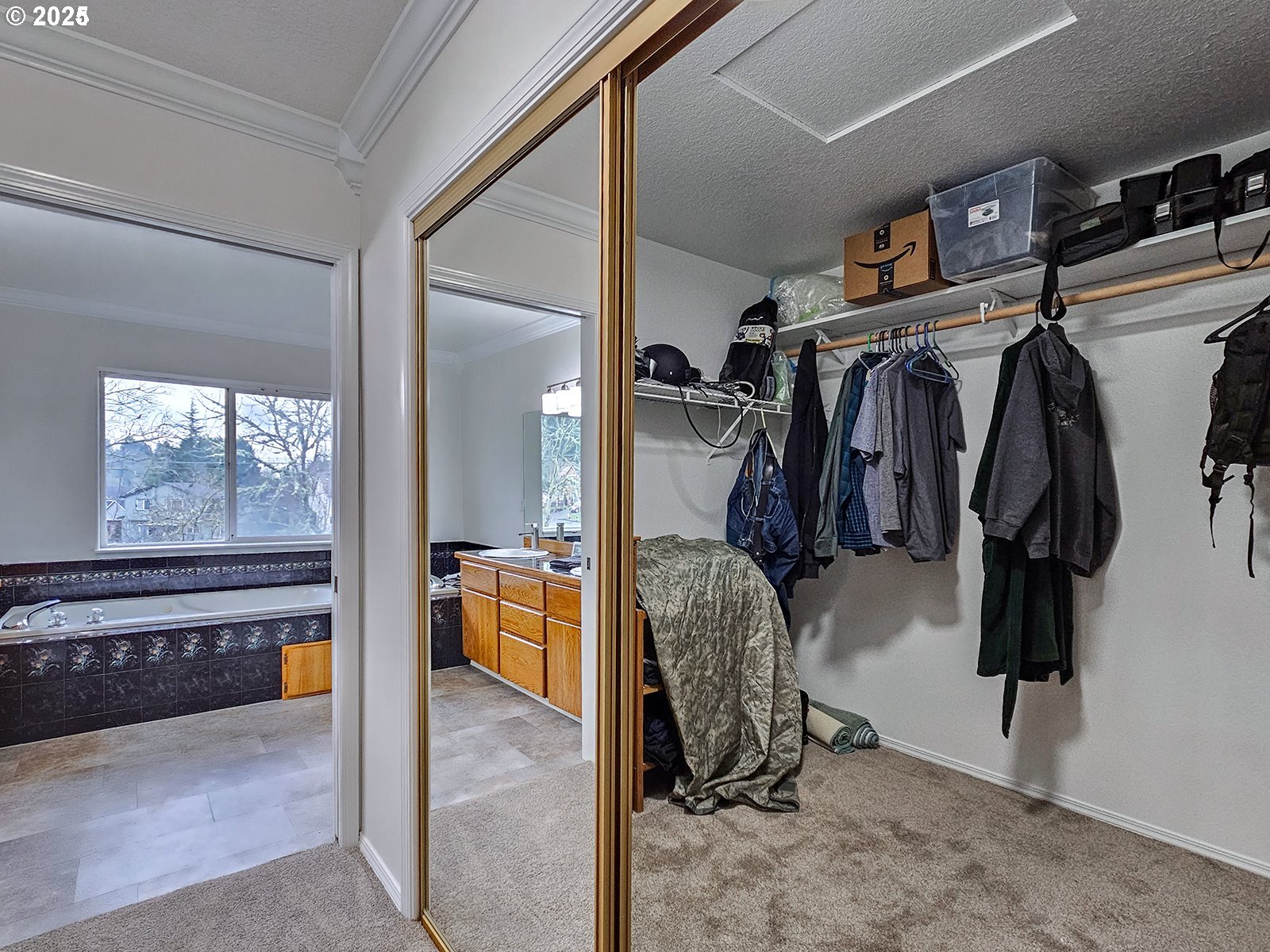 8754 Southwest Wakkila Terrace Beaverton, OR 97007 - Photo 4 of 19 a view of walk in closet with clothes and shoes