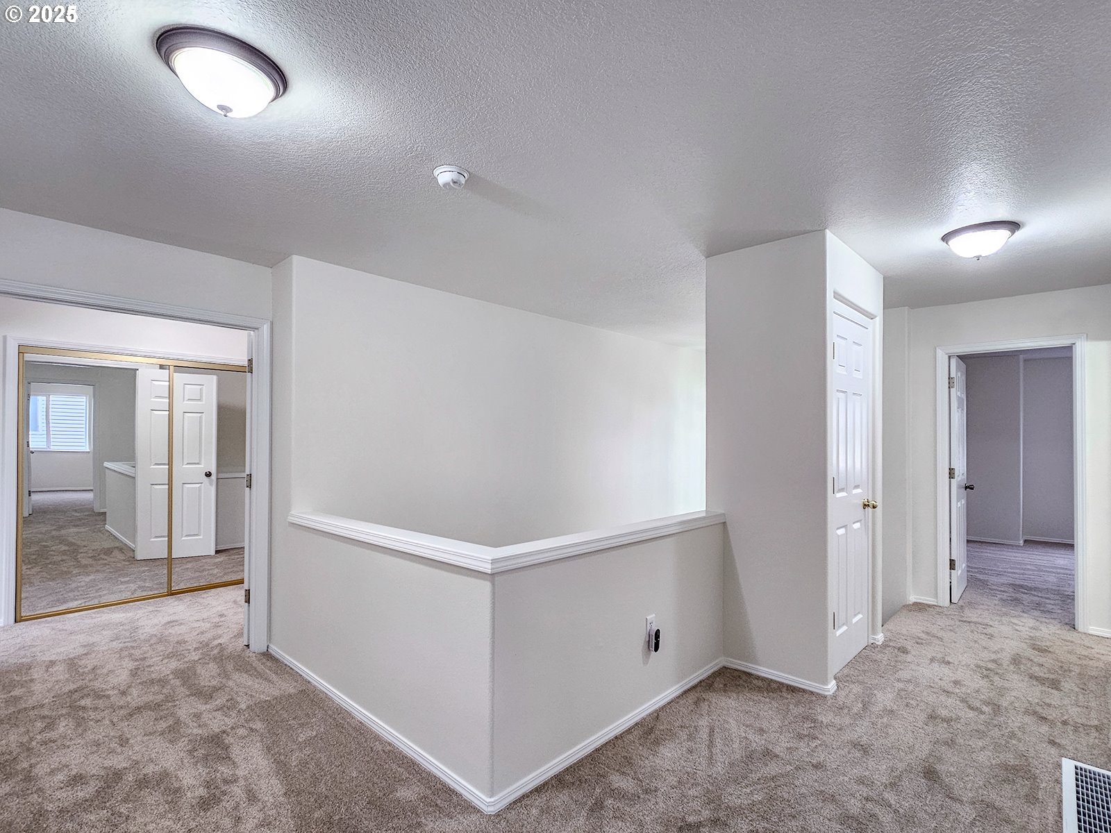 8754 Southwest Wakkila Terrace Beaverton, OR 97007 - Photo 7 of 19 an empty room with closet and windows