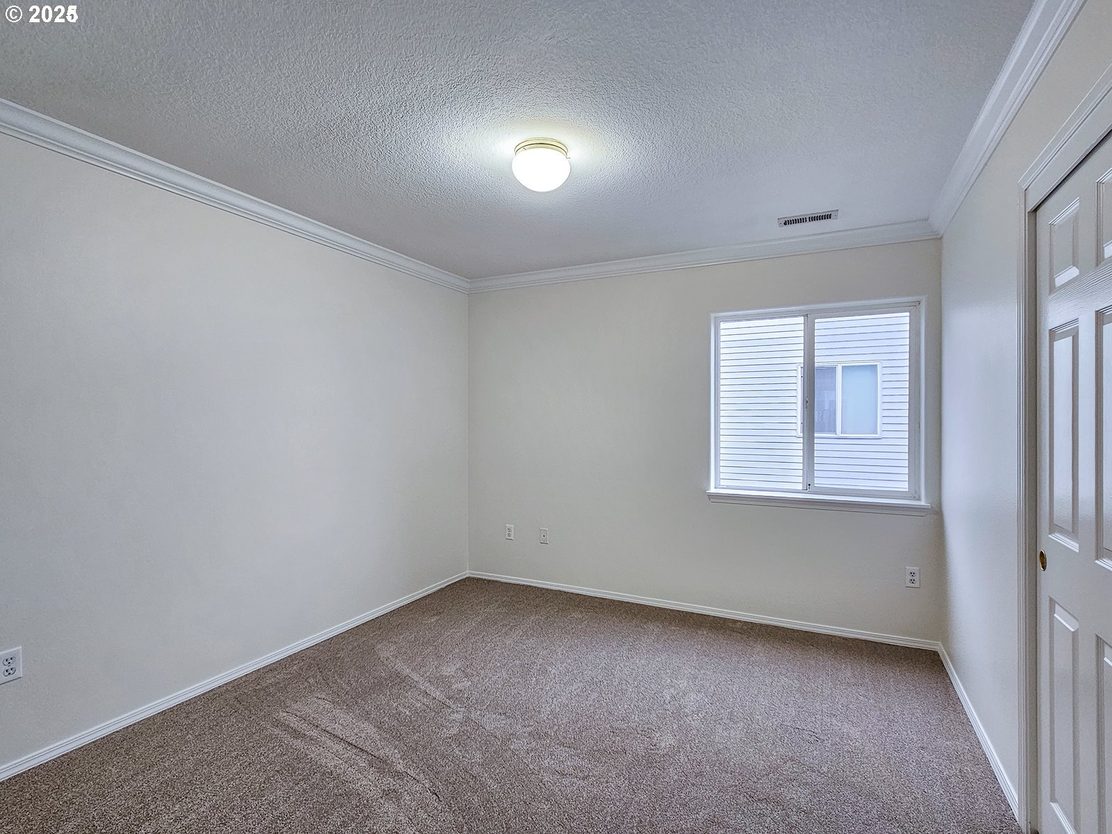 8754 Southwest Wakkila Terrace Beaverton, OR 97007 - Photo 8 of 19 an empty room with a window