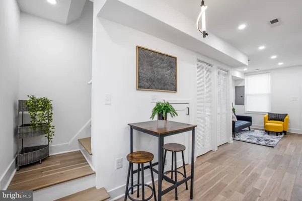 a workspace with furniture and wooden floor