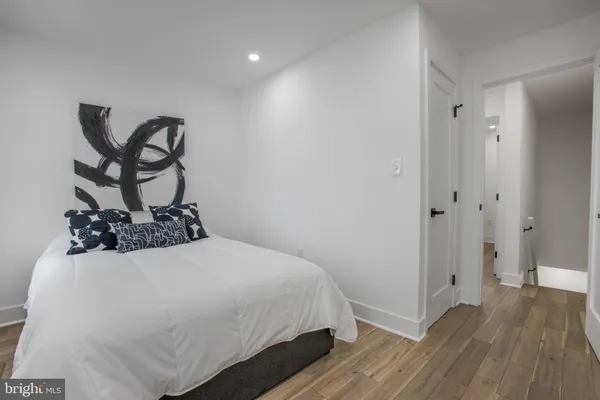 a bedroom with a bed and a dresser
