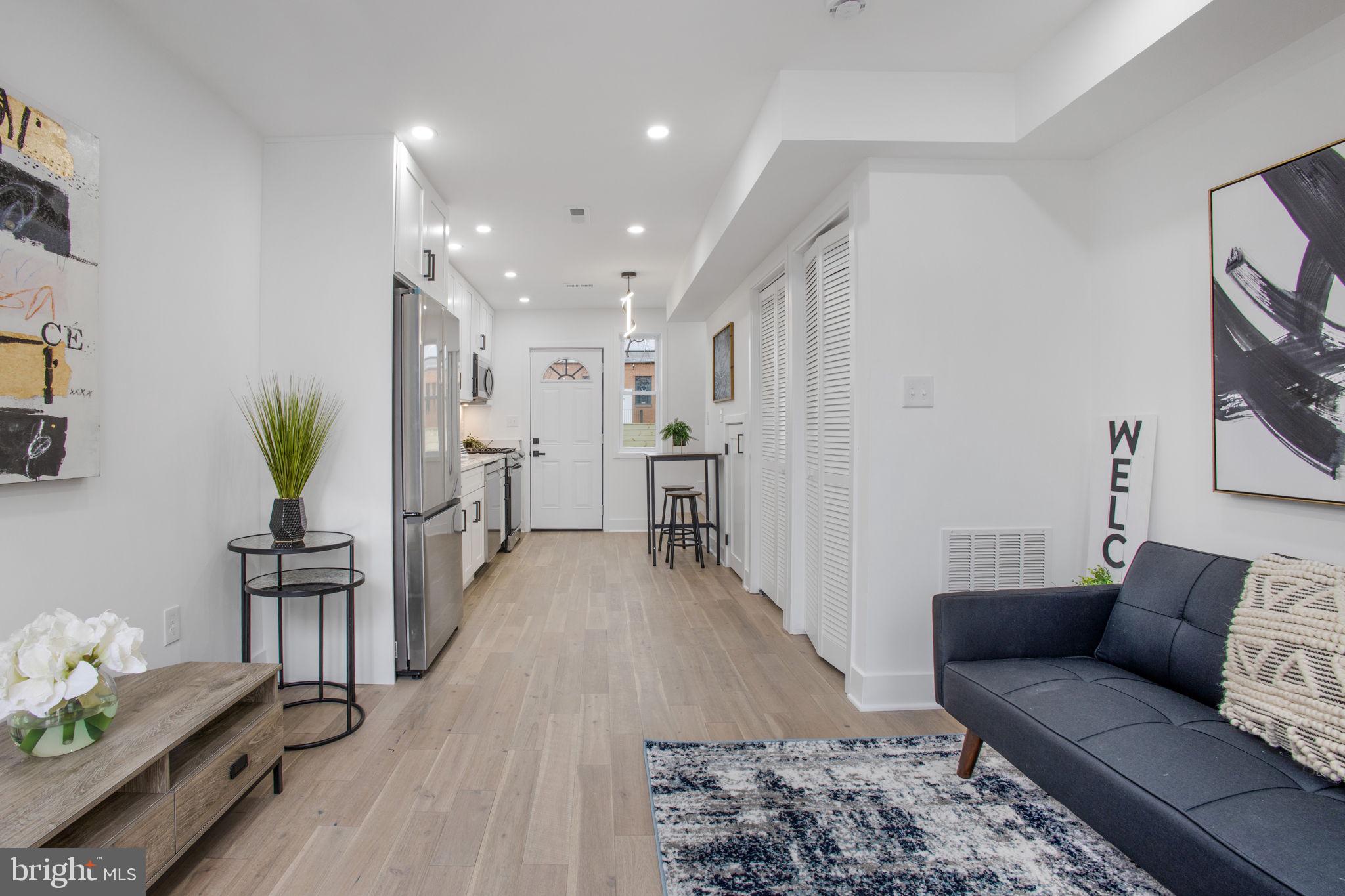 702 19th Street Northeast Washington, DC 20002 - Photo 4 of 38 a living room with furniture and wooden floor