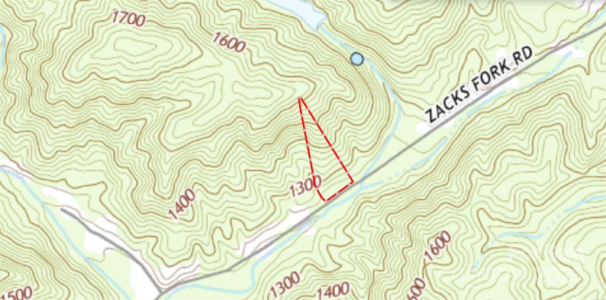 2003 Zacks Fork Road Lenoir, NC 28645 - Photo 13 of 26 a bathroom with a bathtub and a shower curtain