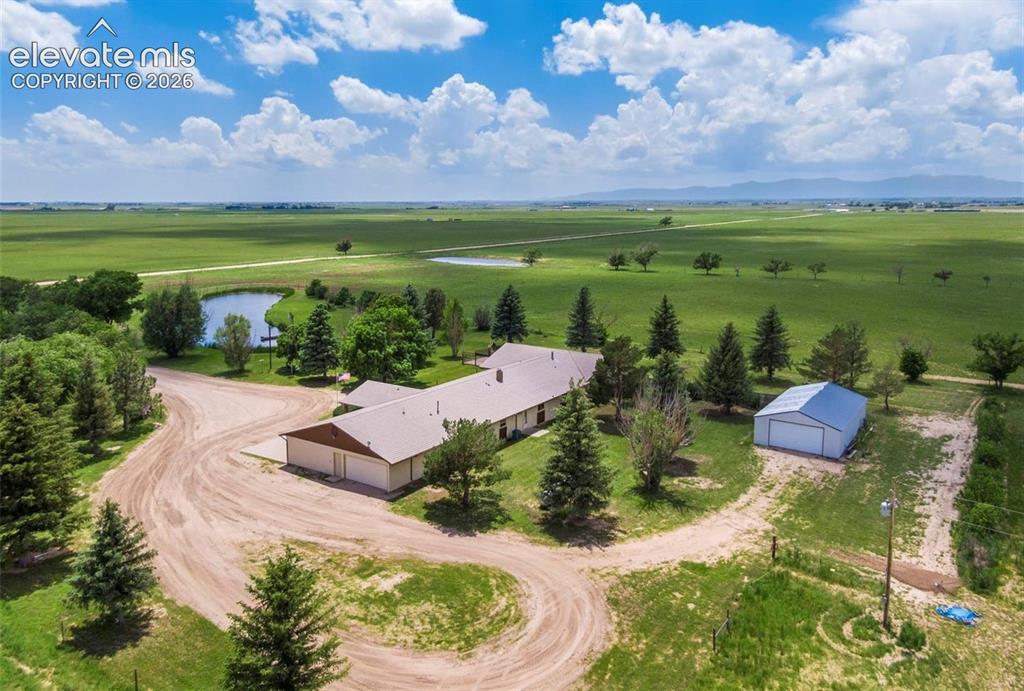 24760 Jones Road Calhan, CO 80808 - Photo 3 of 20 Aeriel view including pond, house and outbuilding