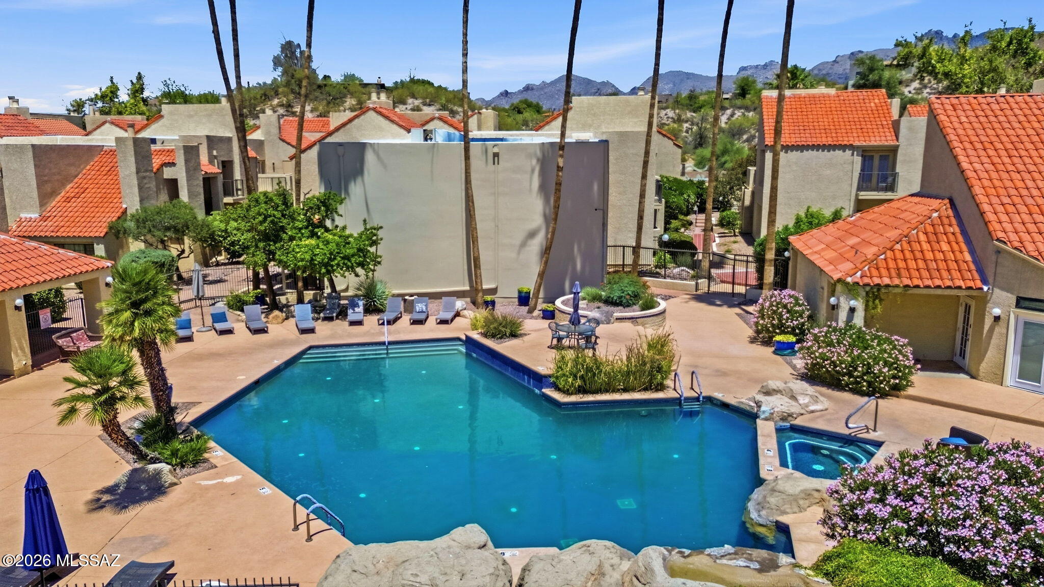 1200 East River Road, Unit G87 Tucson, AZ 85718 - Photo 29 of 30 a view of a house with a swimming pool