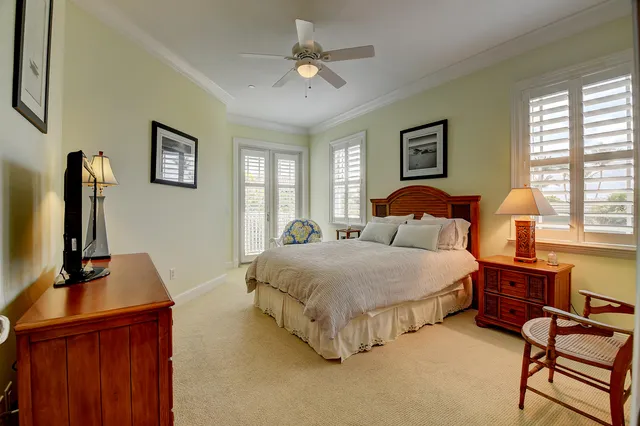 a bedroom with bed and window