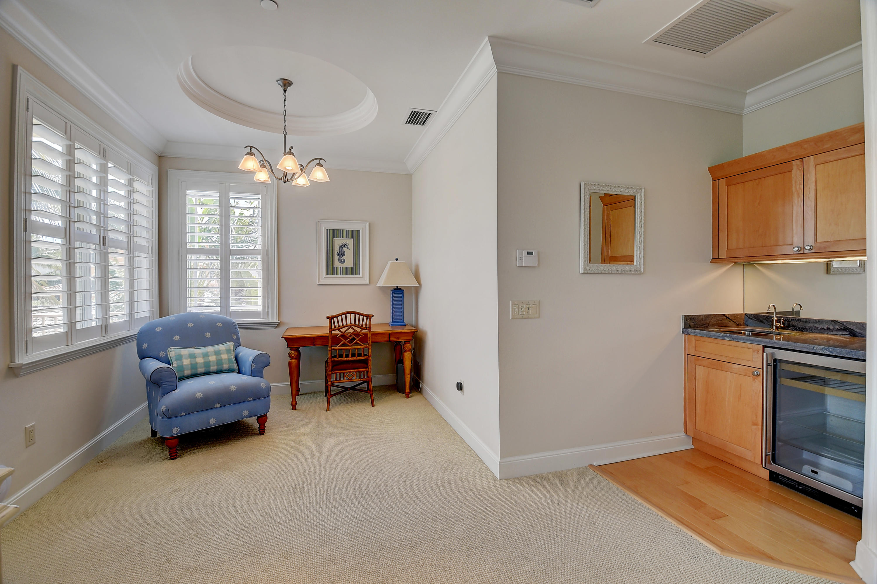 1120 Ocean Terrace Delray Beach, FL 33483 - Photo 27 of 47 a living room with furniture and a chandelier