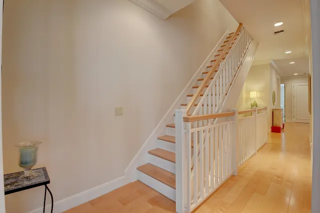a view of staircase with white walls and a window