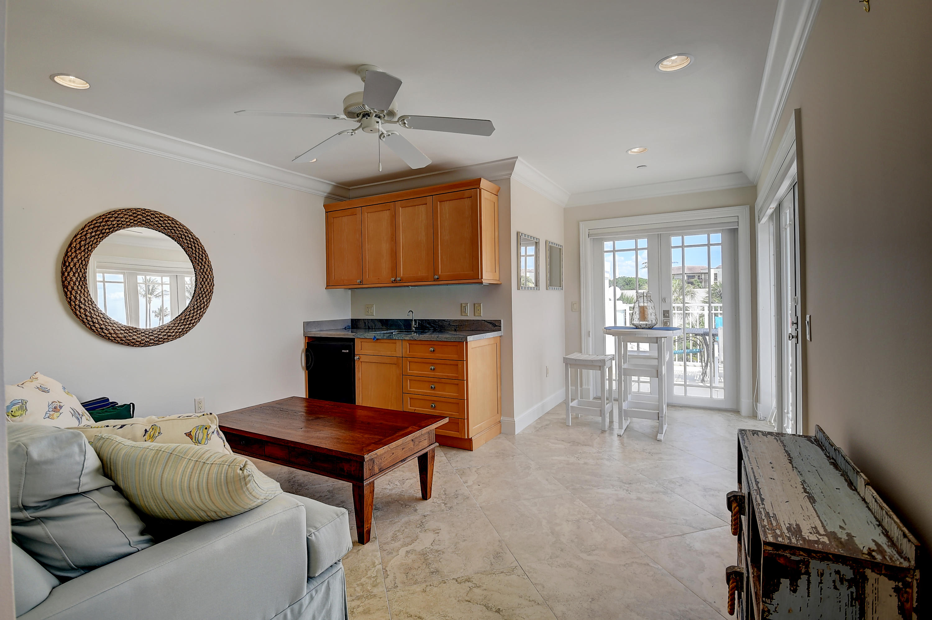 1120 Ocean Terrace Delray Beach, FL 33483 - Photo 35 of 47 a living room with furniture a rug and a fireplace
