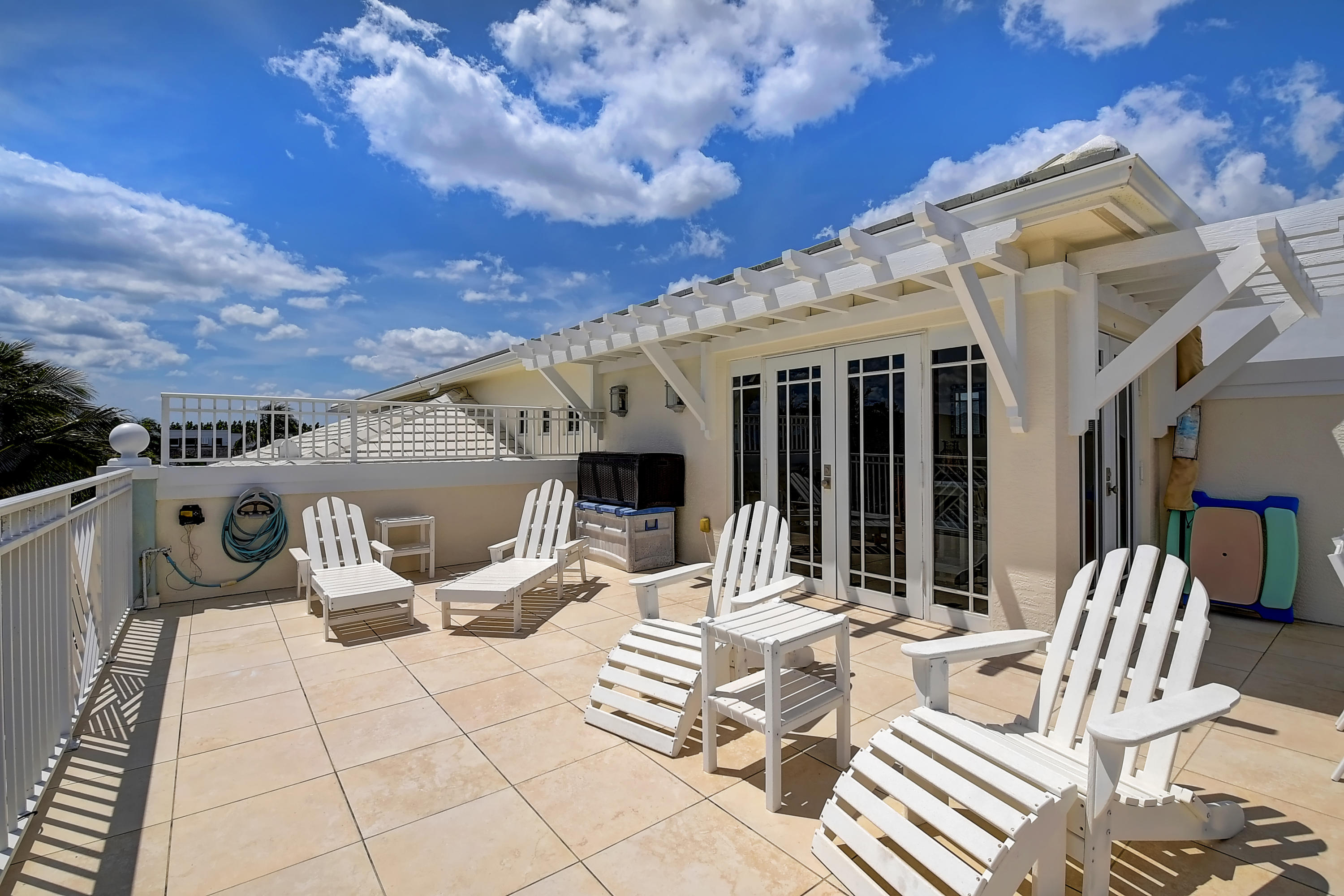 1120 Ocean Terrace Delray Beach, FL 33483 - Photo 42 of 47 a view of a patio with a dining table and chairs with wooden floor