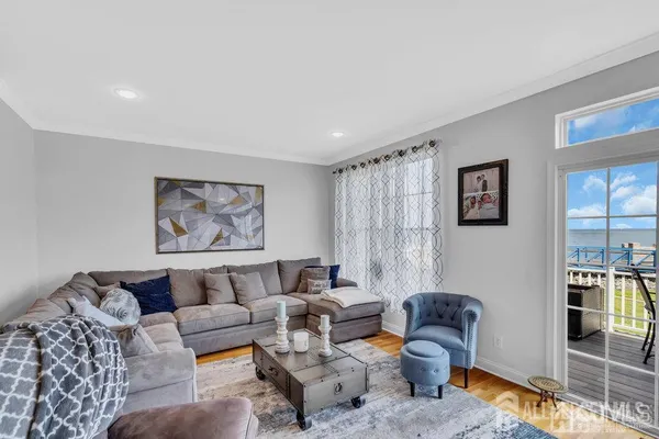 a living room with furniture and large window