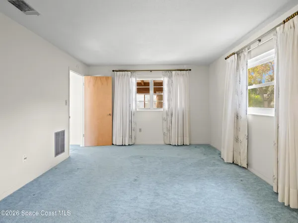 an empty room with windows