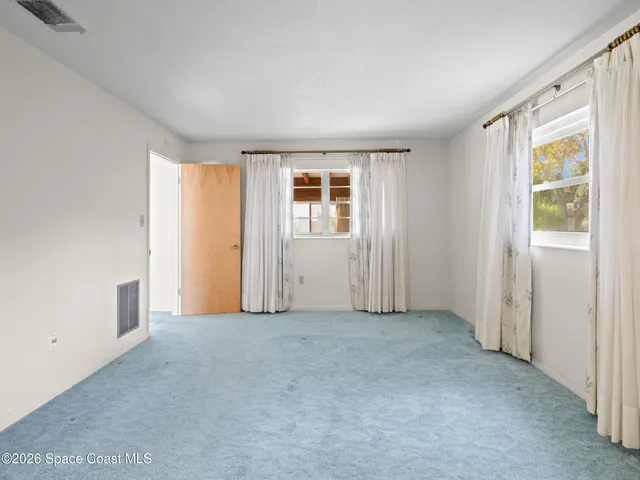 an empty room with windows