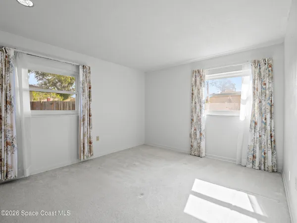 an empty room with windows