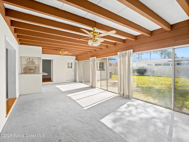 a view of an empty room with a fireplace
