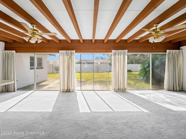 a view of a room with wooden walls