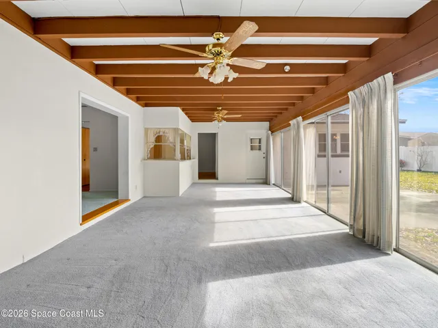 a view of house with yard and swimming pool