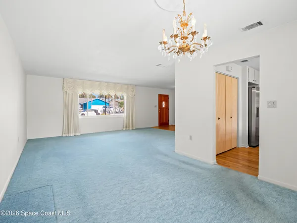 a view of house with swimming pool outdoor seating