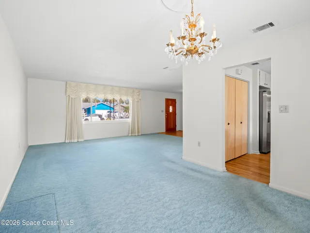 a view of house with swimming pool outdoor seating