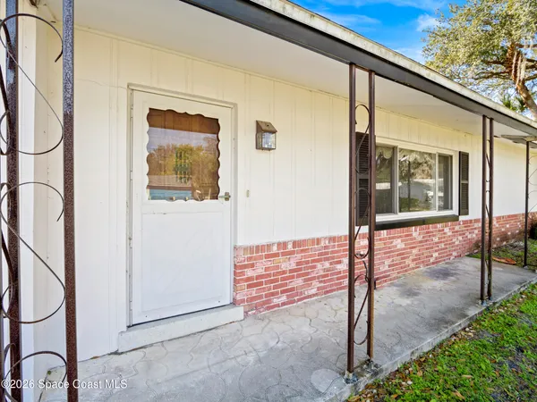 a view of hallway with wooden floor