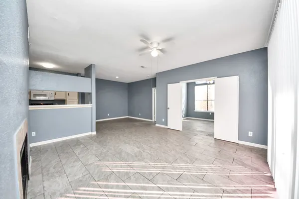 a view of a kitchen with a sink and a window