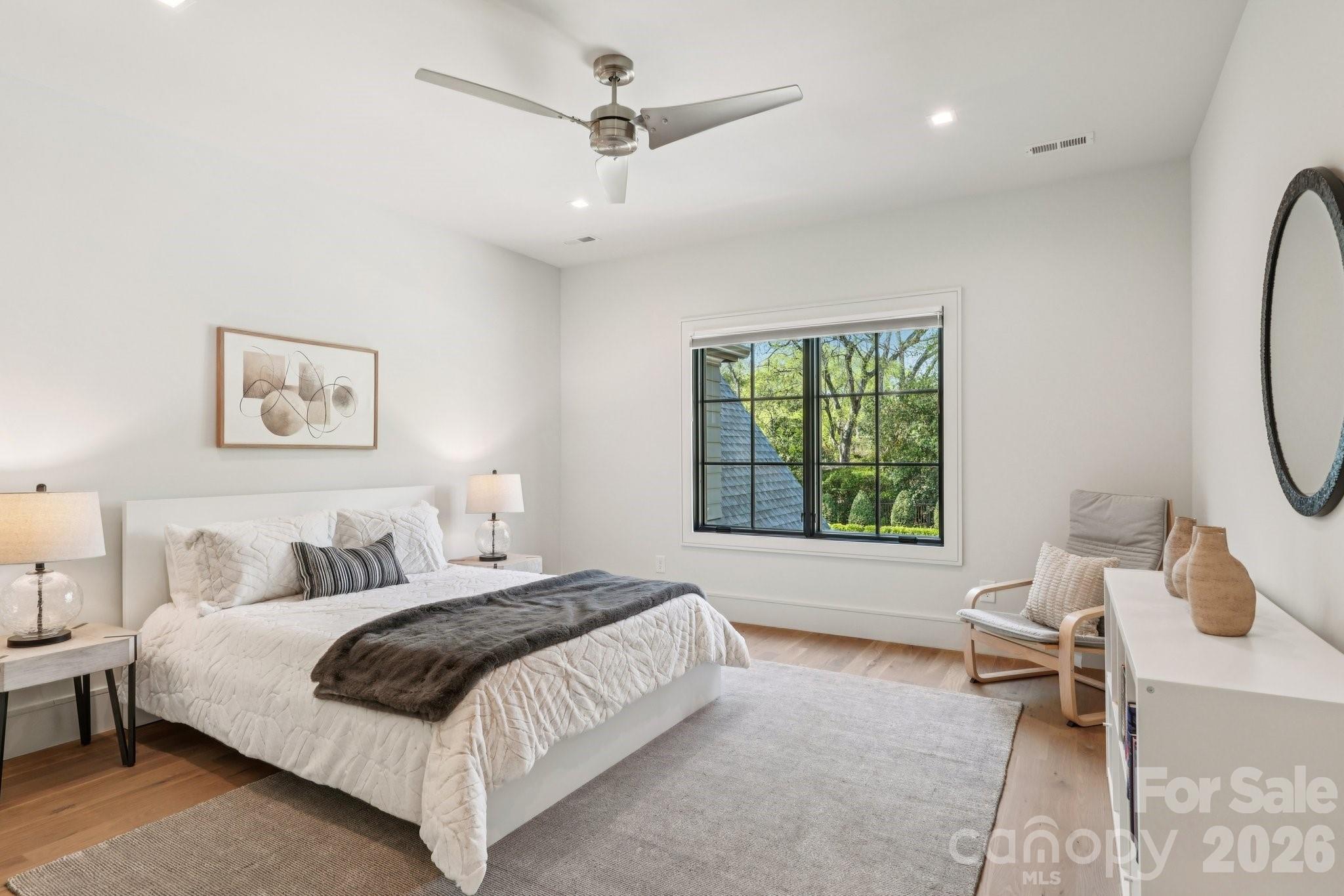 2103 Cortelyou Road Charlotte, NC 28211 - Photo 29 of 45 a spacious bedroom with a bed and a window