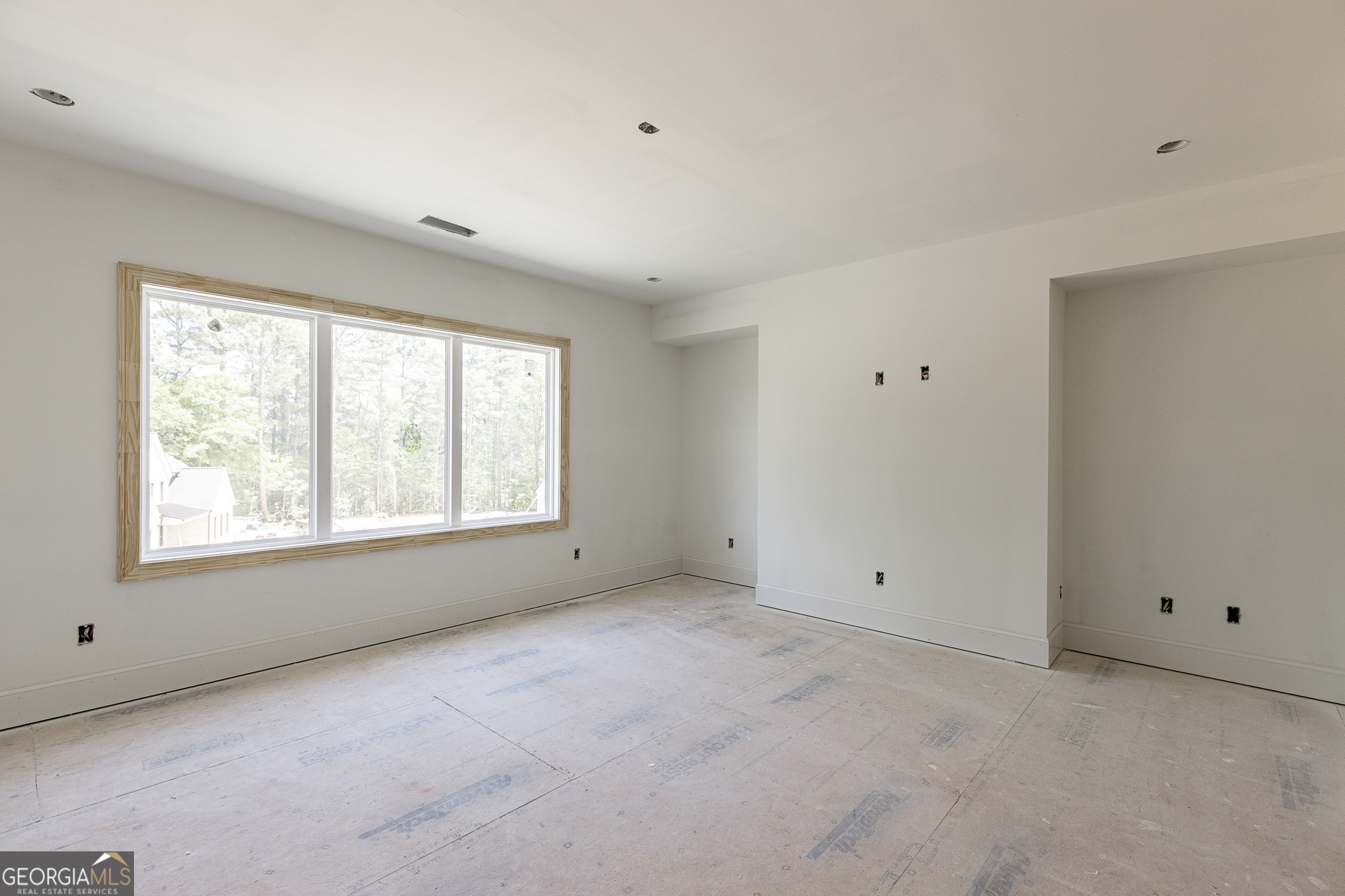 2969 North Bogan Road Northeast, Unit 1 Buford, GA 30519 - Photo 31 of 51 a view of an empty room with a window