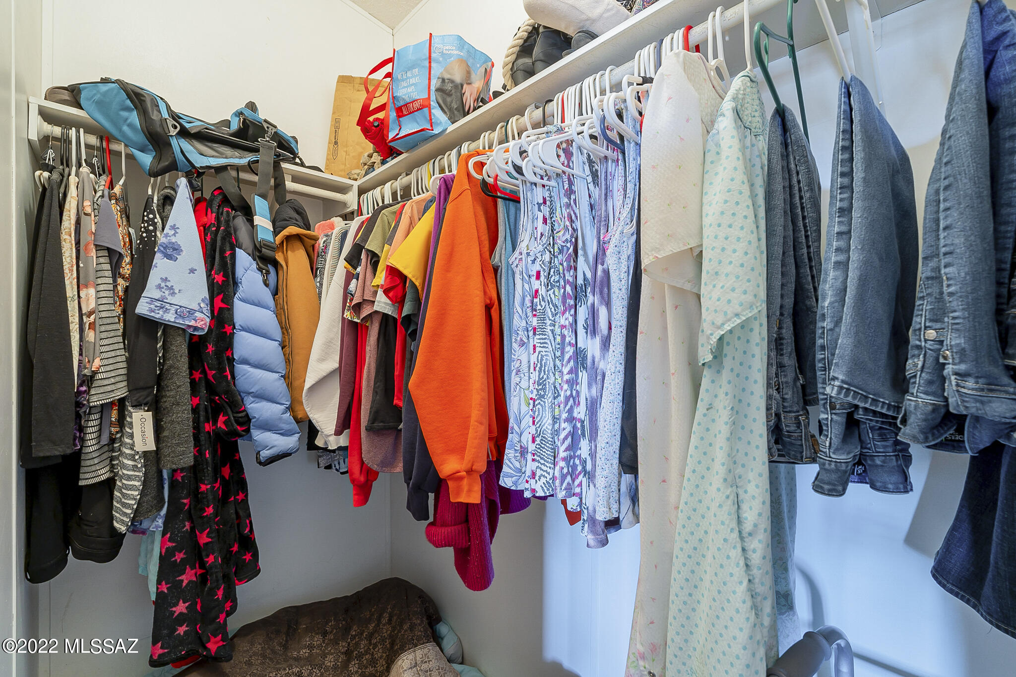 5285 North Puma Road Marana, AZ 85653 - Photo 23 of 46 a view of walk in closet with clothes and shoes