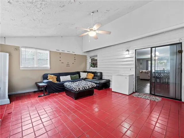 a bed room with a bed and a window